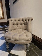 Padded Grey Decorative Chair With Rolled Back