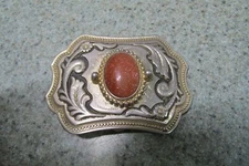Real or faux sand stone mounted belt buckle