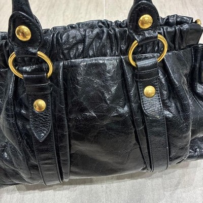 MIU MIU Vitello Lux Leather Handbag Black Gold Gathered Top Handle