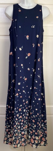 Navy blue midi dress with small white floral print, pink edges, sleeveless design, and “E.D. Michaels” label on neckline.