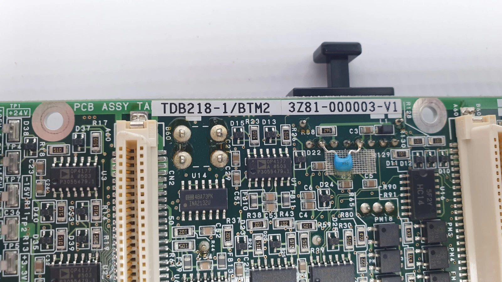 Close-up of the TDB218-1/BTM2 and 3Z81-000003-V1 label with OP4177 and INA2132U ICs