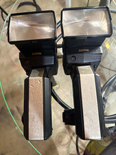 Sunpak 622 Super Pro Handle Mount Flash s with Zoom heads and battery cluster x2