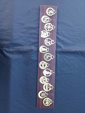 Collection Of Horse Brass Ornaments On Wooden Plinth