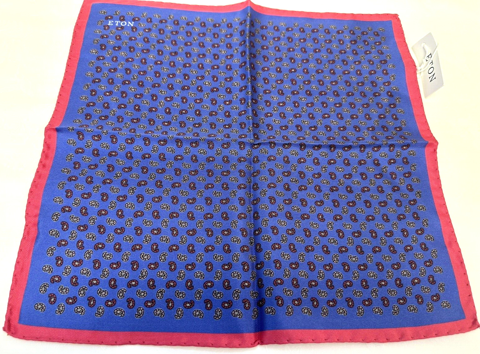 NEW! Eton blue silk with a paisley style pattern and pink border pocket square