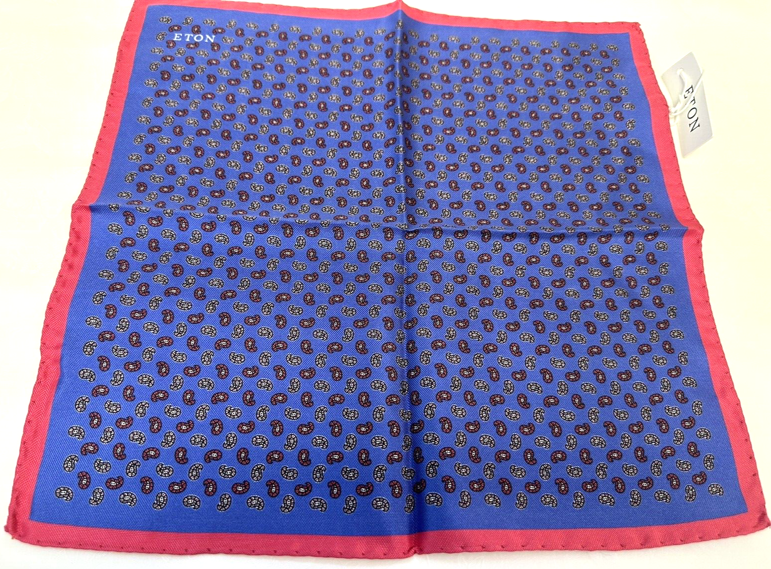 NEW! Eton blue silk with a paisley style pattern and pink border pocket square