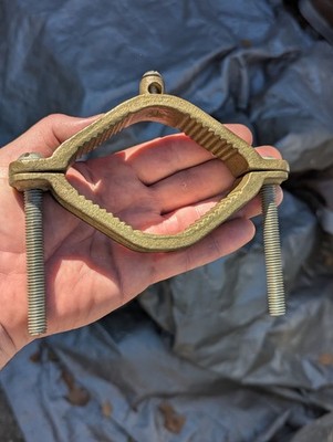 pipe clamp ground j2124 2 1/5 4 '' brass or bronze ,metal ? electric part tool