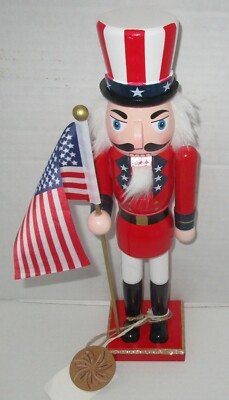 PATRIOTIC NUTCRACKER ~14 inches ~ UNCLE SAM~ RED UNIFORM ~ HOLDING AMERICAN FLAG