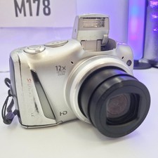 Canon PowerShot SX150 IS Digital Camera 14.1MP Silver. Good / Worn Working refbf