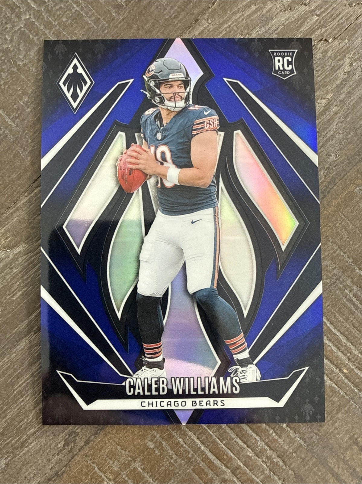 2024 Panini Phoenix - Rookies Caleb Williams #151 Blue Fade /249 (RC)