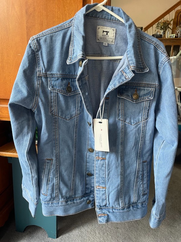 Jeans Jacket-new with tags.  The tag says it's an XL but fits more like a Medium