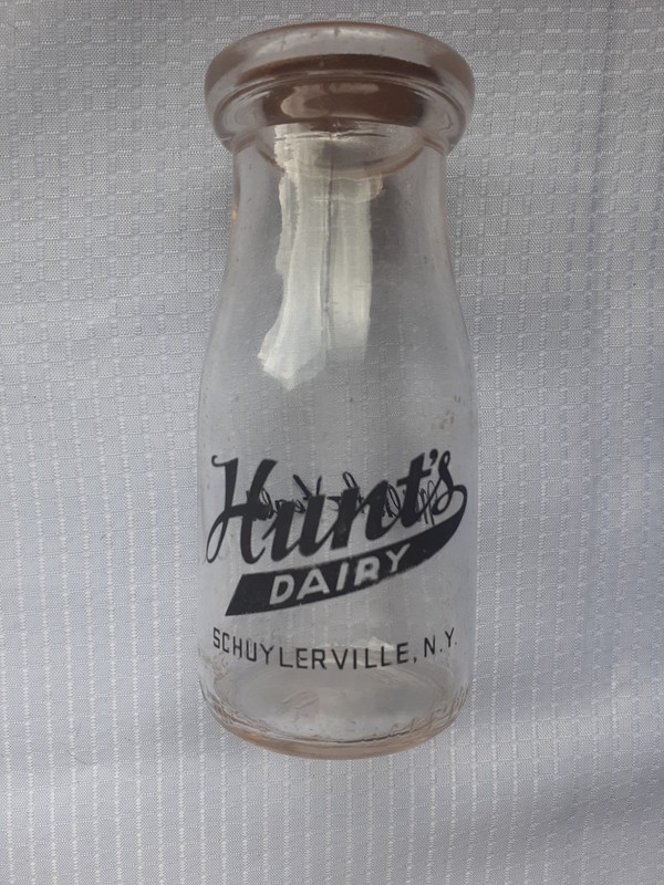 Vintage half pint Hunts Dairy glass milk bottle with cork