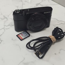 Sony Cybershot DSC-RX100 I M1 20.2MP Digital Camera Zeiss Case w/ 64GB SD Card
