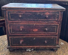 Early 19thc miniature ebonised pine chest of three drawers on bun feet