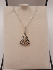 ORTAK STERLING SILVER ARCHIBALD KNOX PENDANT AND CHAIN IN ORIGINAL BOX