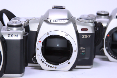 Lot of 3 Pentax ZX-M (2) & zx-7 (1) 35mm Camera bodies - Power on