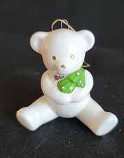 White Ceramic Sitting Teddy Bear Holiday Ornament Holding Green Toy Gold Eyes