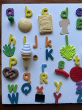 Lower case alphabet letters Magnetic With Objects And Some Upper case Letters.