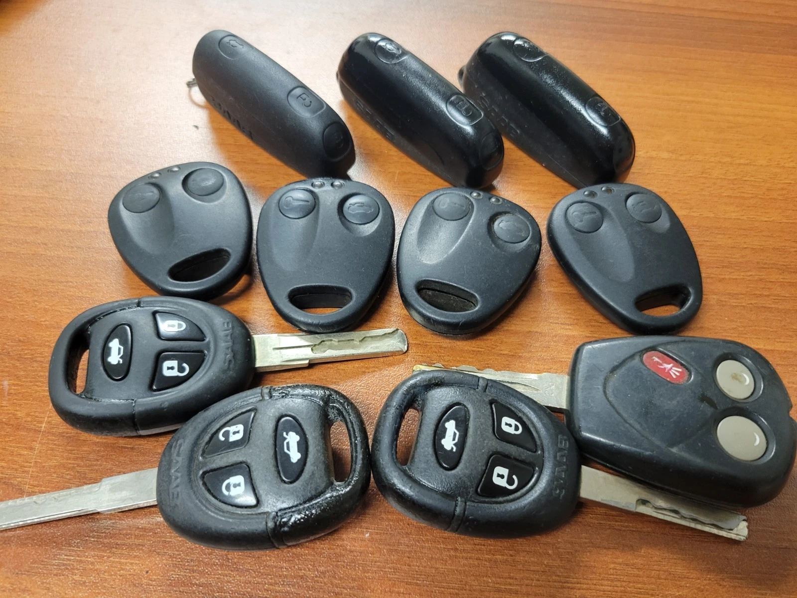 Lot of 11 OEM Saab Key Fobs Remotes Smart Keys Ignition Keys Mixed Used - product detail image 1