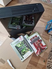 Microsoft Xbox 360 E 500GB Black with 2 games and comes qith ghe original box