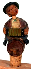 RARE VINTAGE AUSTRIAN MAN PLAYING ACCORDION SITTING ON KEG BOTTLE STOPPER 4"TALL