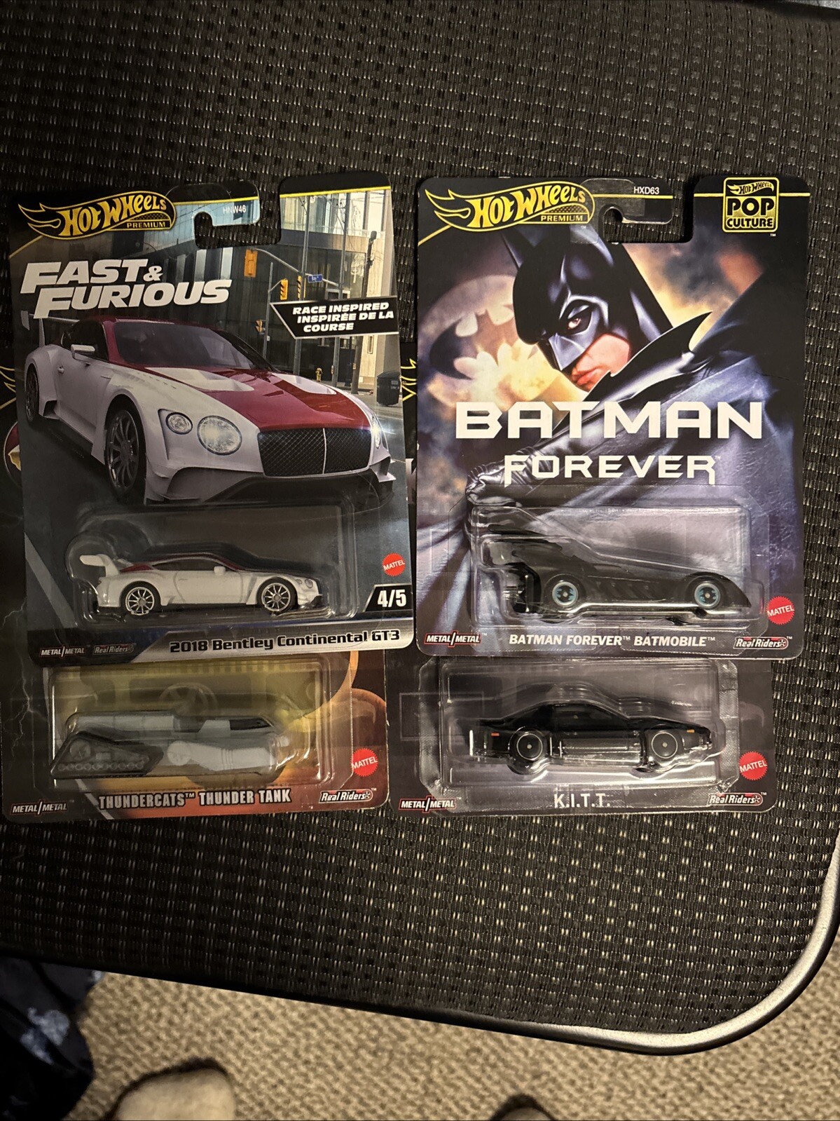 Four hot wheels premiums. $20. Free shipping. Batmobile. Thunder tank. KITT.