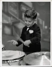 1955 Press Photo Keith Thibodeaux plays drums in the "Swift Show Wagon"