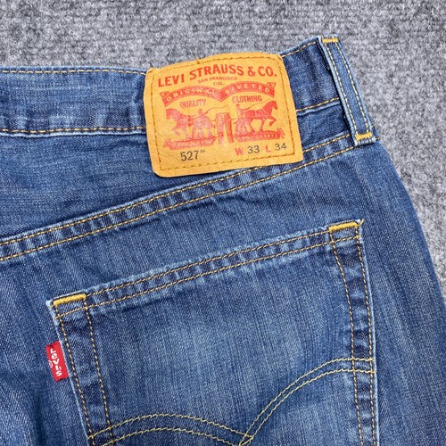 Pantalones de mezclilla Levis 527 para hombre 33x34 azul calce ajustado bootcut etiqueta lavado medio 33x34 - Imagen 4 de 14