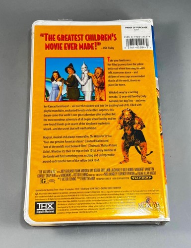 MGM The Wizard Of Oz 1996 VHS cover with ruby slippers, flying monkey, lion, and Wizard Of Oz characters.