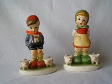 pair of imitation Goebel hummel boy and girl figurines, slight damage to base