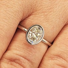 2.00ctw Oval Cut VVS1 Moissanite Bezel Set Engagement Ring 14K White Gold Plated