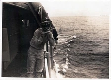 WW2 Photo of Navy Officer Leaning over Rail Taking Picture at Sea