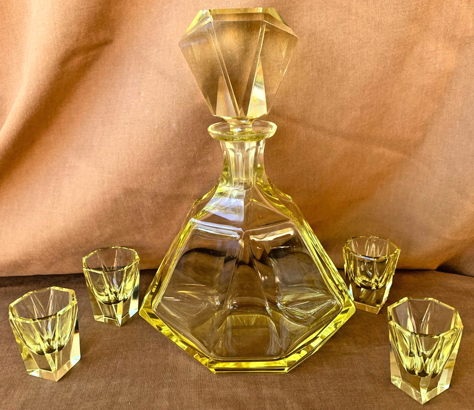 A complete 1930s Czech Art Deco yellow cut-faceted glass decanter set with 4 matching glasses in excellent condition — a full party-ready time capsule.
