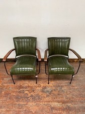 Pair of green leather armchairs with metal frame