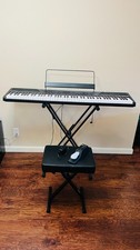 Alesis recital 88 key digital piano keyboard with stand, pedal, and bench