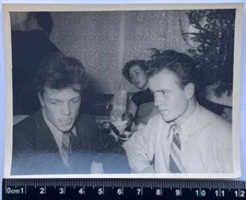 two attractive mysterious young men, the guy stuck out his tongue, gay interest