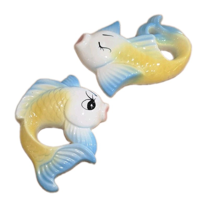 A grinning anthropomorphic fish wall plaque in chalkware — pure mid-century kitsch that belongs above a tiki bar or in a retro bathroom.