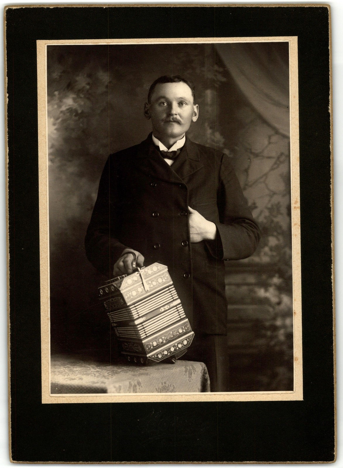 Mounted Board Photo Circa 1900  Man Mustache Dark Suit Holding Concertina