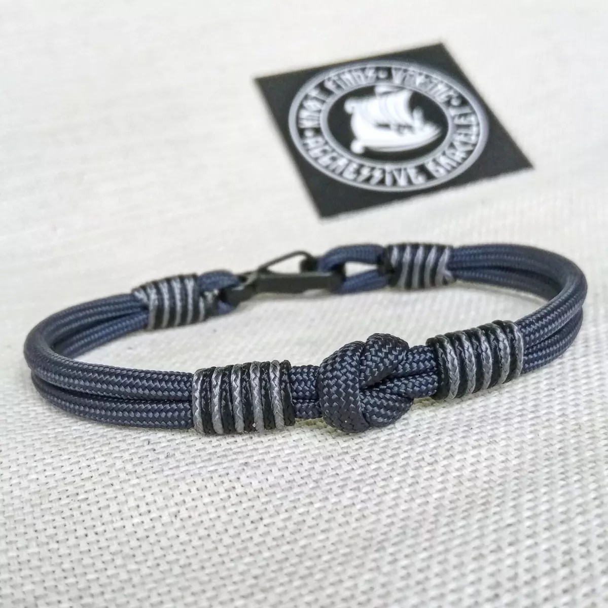 Thin Viking paracord bracelet with a carbine.