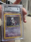 Pokemon Wizards of the Coast Mewtwo Base Set 10/102 1999 Holo Rare CGC 8