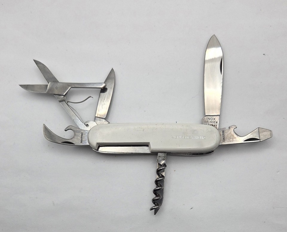 A vintage Mercedes-Benz branded multi-tool pocket knife from Solingen, Germany — official marque merch from an era when car brands made seriously nice hardware.