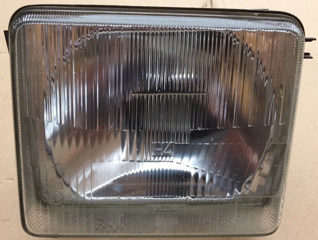 Phare avant gauche neuf Volvo 240 pièce origine constructeur en verre