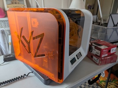 XYZprinting Da Vinci Jr. 1.0 3-in-1 3D Printer with boxes of Filament