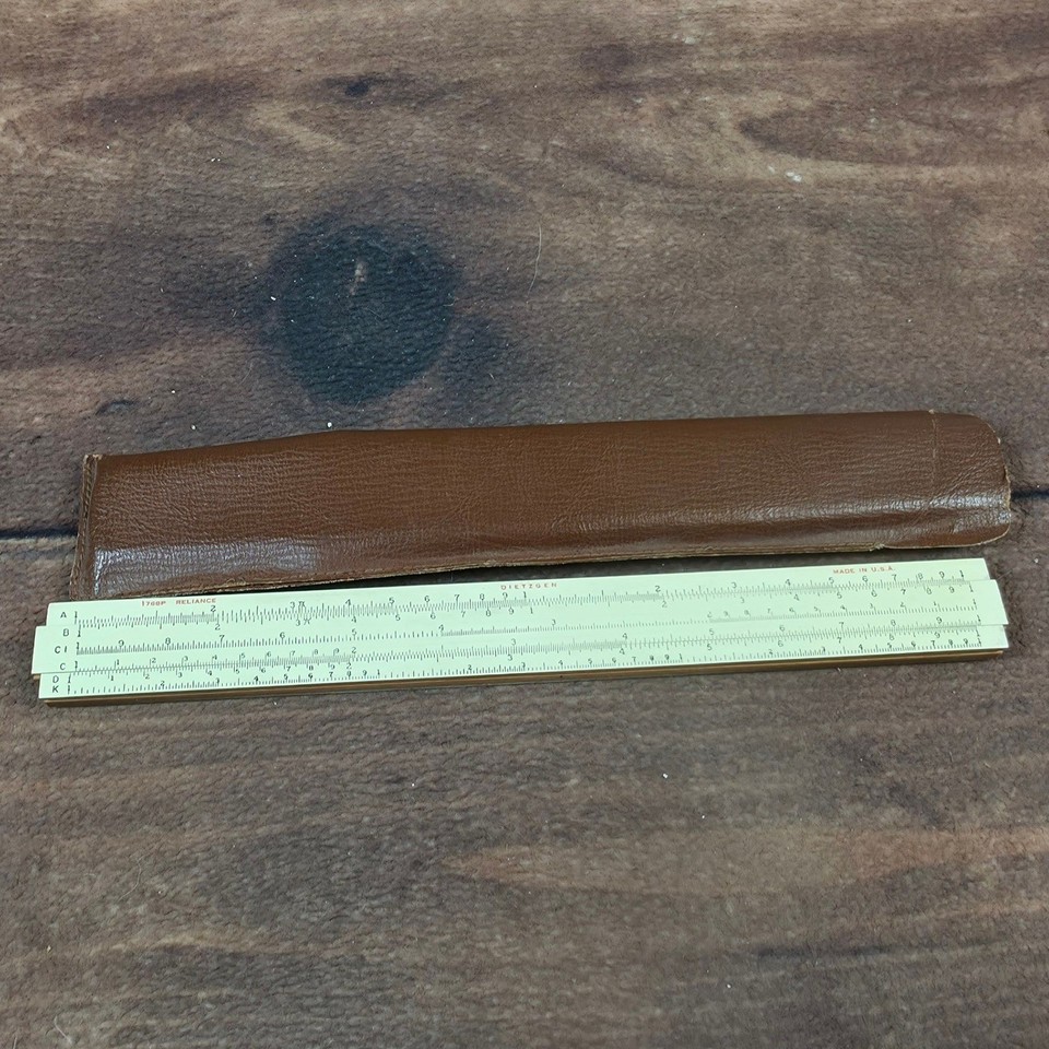 A made-in-USA Dietzgen slide rule in good condition with its original case — a crisp piece of mid-century American engineering culture.
