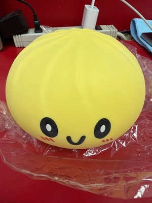 Bring a smile to your day with this adorable yellow emoji stress ball! Perfect f