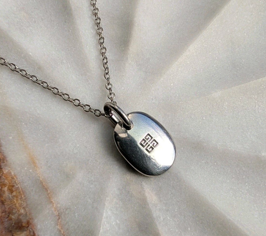 Vintage Givenchy silver-tone pendant necklace with the brand