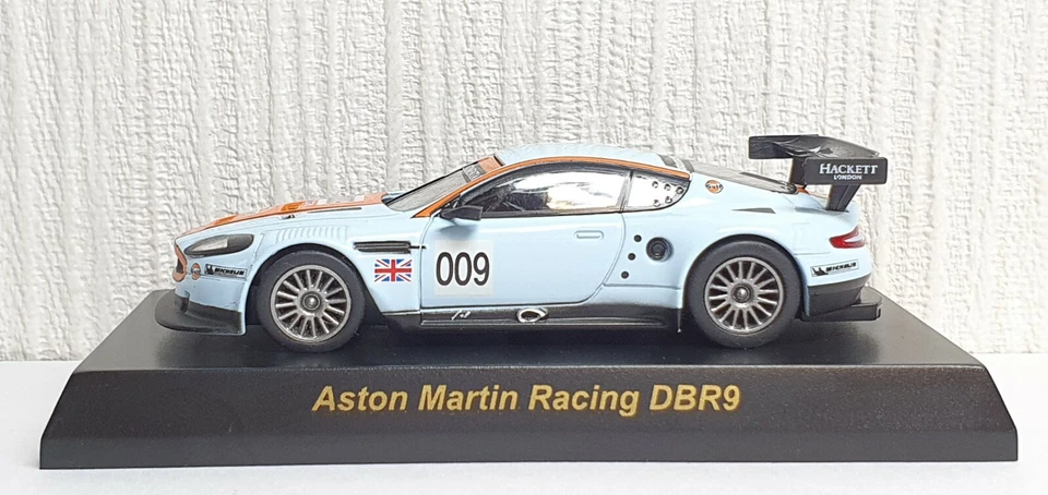 Modelo de coche fundido a presión 1/64 Kyosho ASTON MARTIN RACING DBR9 009 GOLF  Foto 2 de 4
