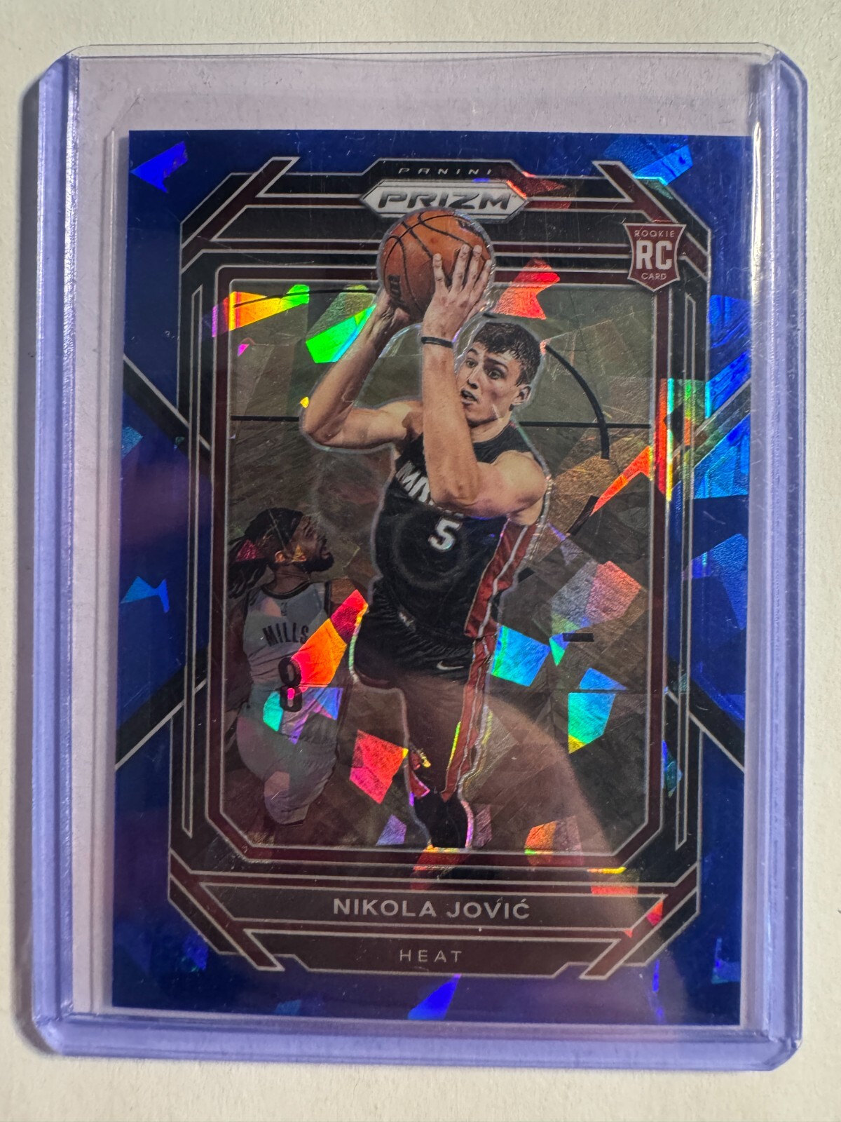 K310,591 - 2022-23 Panini Prizm Prizms Blue Ice #236 Nikola Jovic #/125