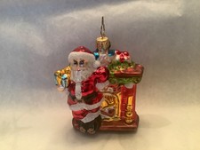 Christopher Radko Heart-Felt Gift Santa Standing by Fireplace Glass Ornament.