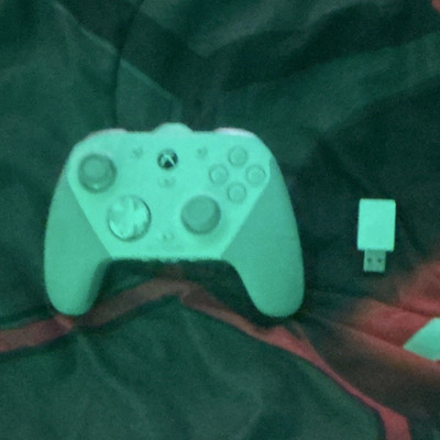 White xbox wireless scuff gaming controller and a razer huntsmen mini keyboard.