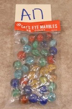A17B VINTAGE 35 COUNT BAG OF CAT'S EYE MARBLES JAPAN